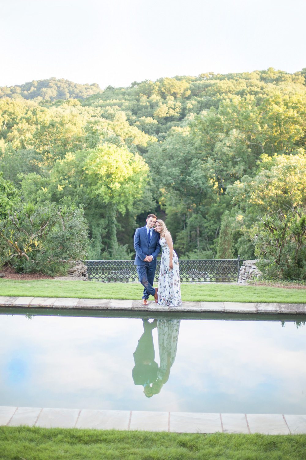 couple next to reflection pool engagement session at cheekwood estate and gardens