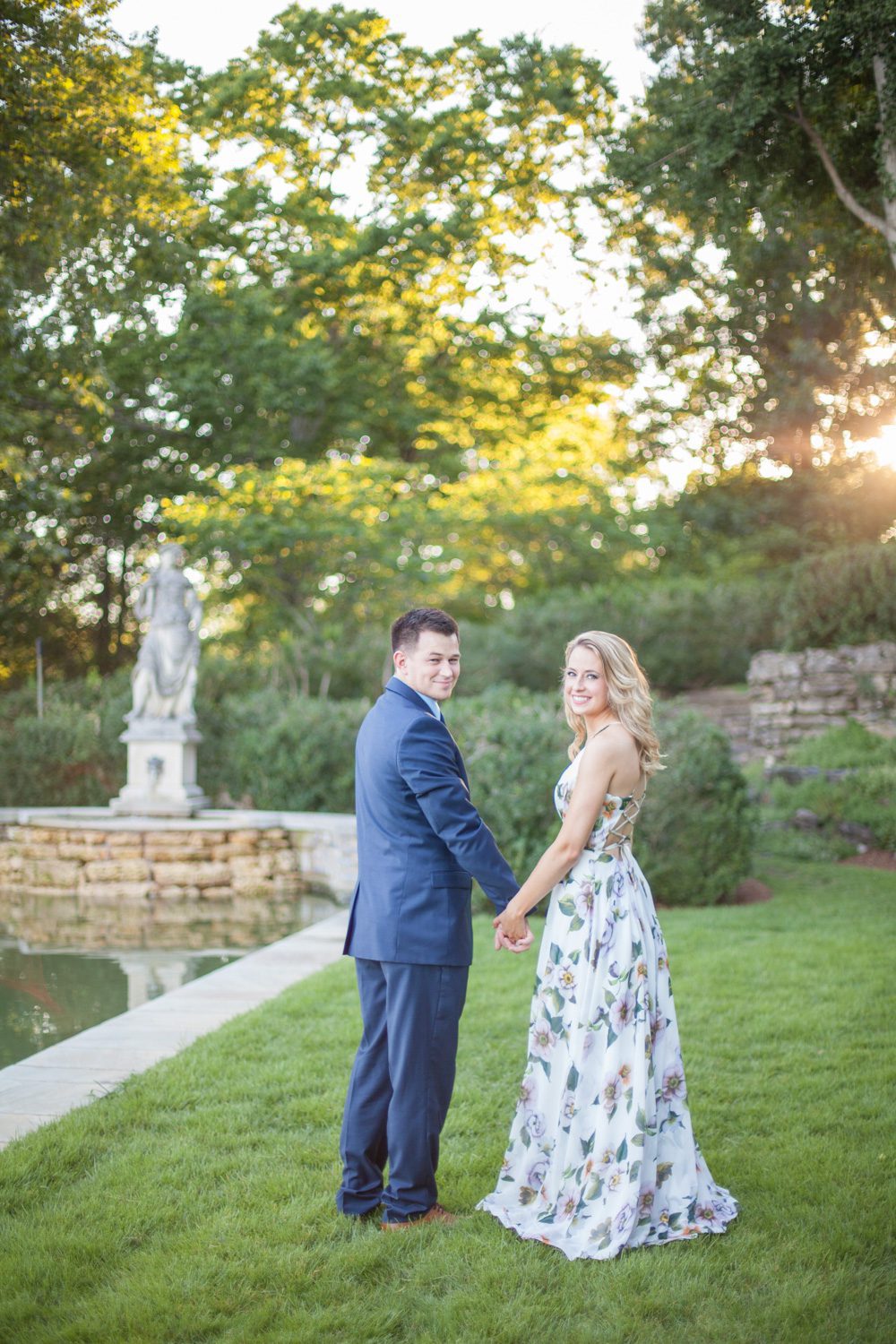 couple walking for engagement session at cheekwood estate and gardens photo by krista lee photography