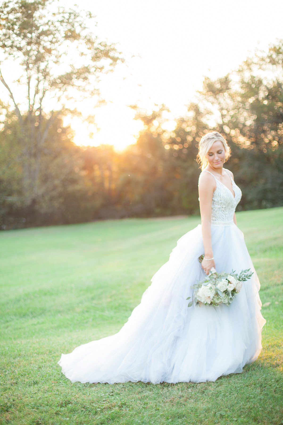 Photo of bride at sunset after wedding ceremony. Wedding photography at Cedarwood Weddings and Estate in Nashville, TN photography by Krista Lee Photography