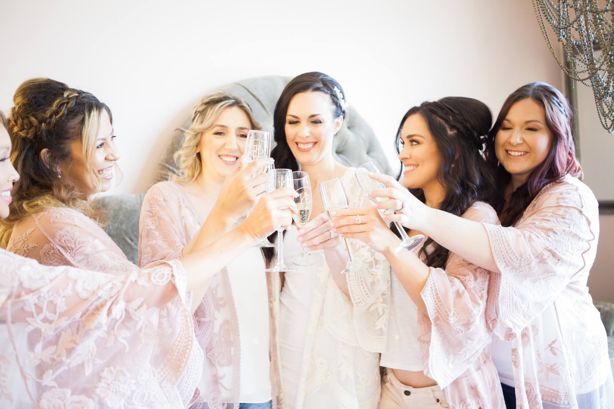 Bridesmaids toast with the bride and get ready at Hunter Paige Salon in Brentwood, TN. Photos from David and Jennifer's Cedarwood spring wedding, photography by Krista Lee. 