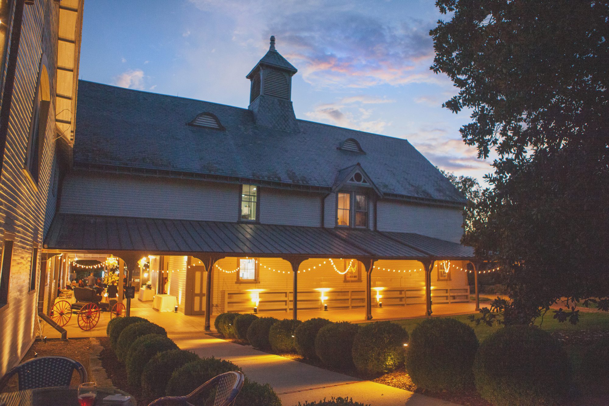Dusk photo of the historic barn after wedding at Belle Meade Plantation in Nashville, TN. Photos by Krista Lee Photography 