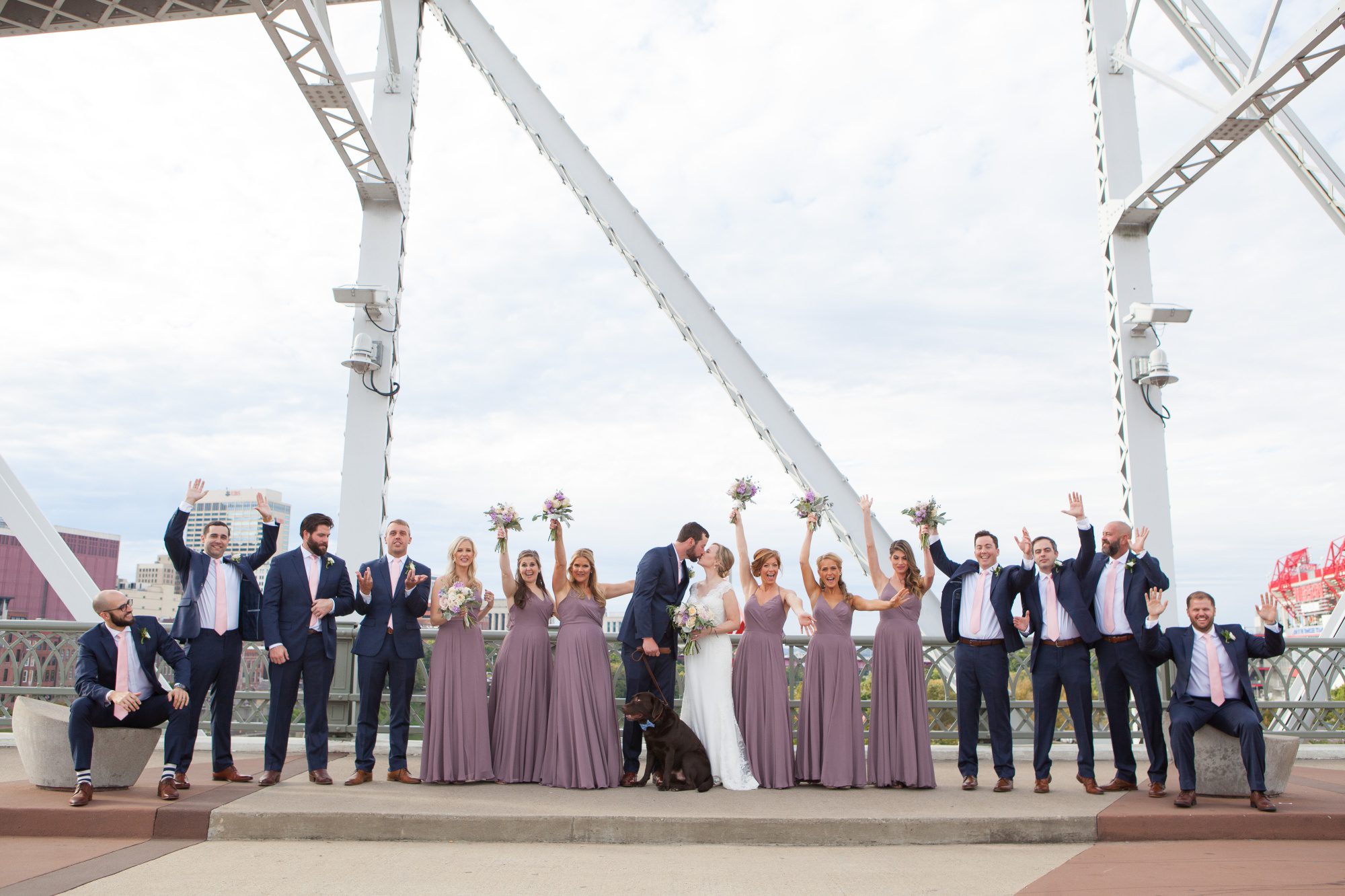 Bridal party photos up on Pedestrian bridge before wedding photography at Musicians Hall of Fame in Nashville TN photos by Krista Lee 
