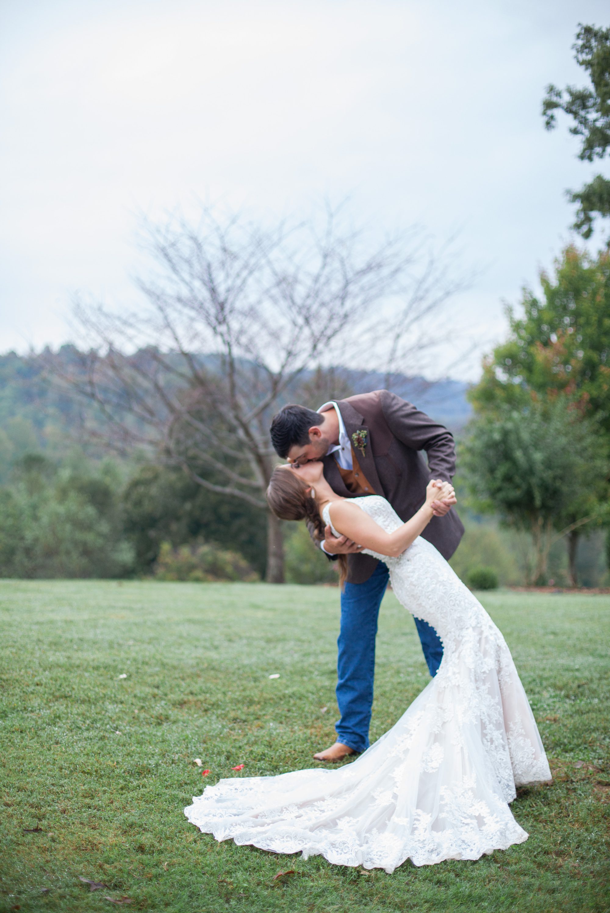 Groom Dips bride for a photo after wedding ceremony photography at Front Porch Farms, Wedding photography by Krista Lee