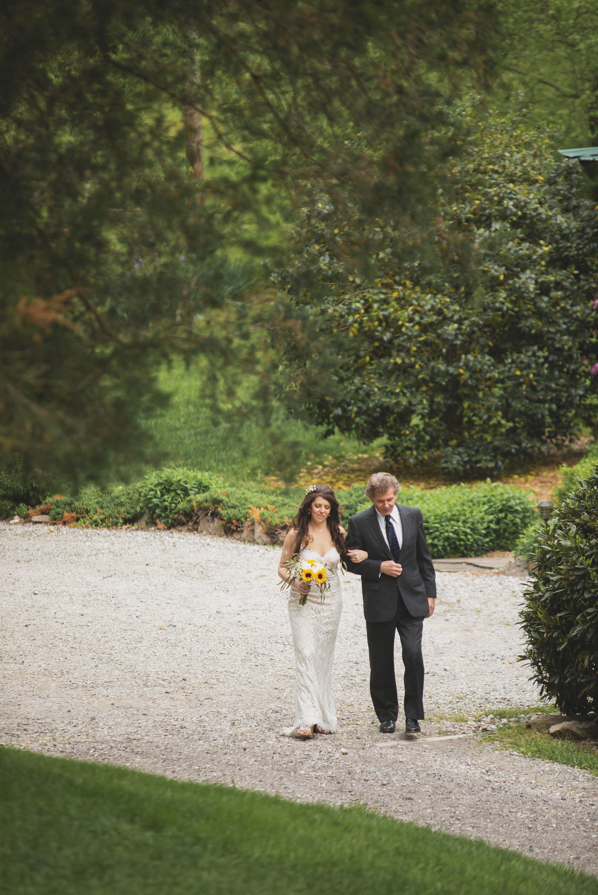 Bride walks with father for processional before elopement wedding ceremony at Butterfly Hollow in Gordonsville, TN. Photos by Krista Lee Photography. 