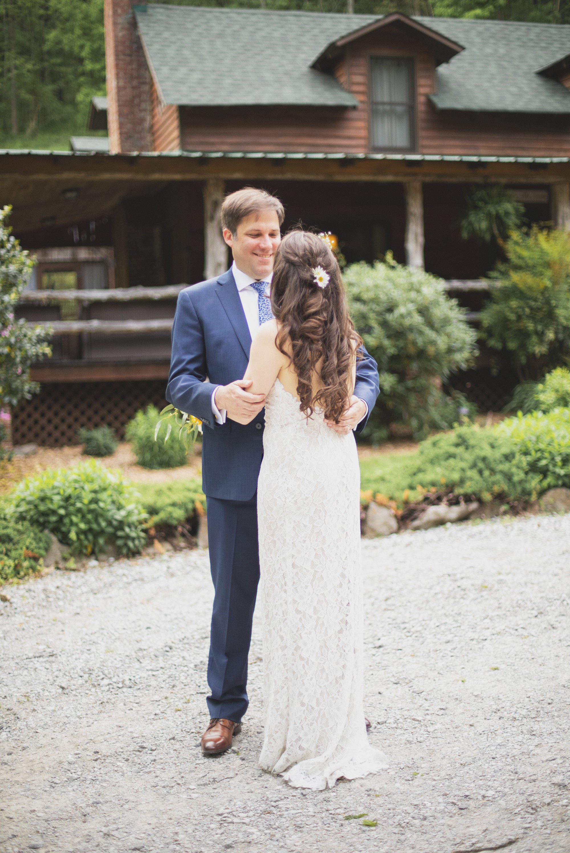 Bride and groom in front of cabin after elopement wedding ceremony at Butterfly Hollow in Gordonsville, TN. Photos by Krista Lee Photography. 