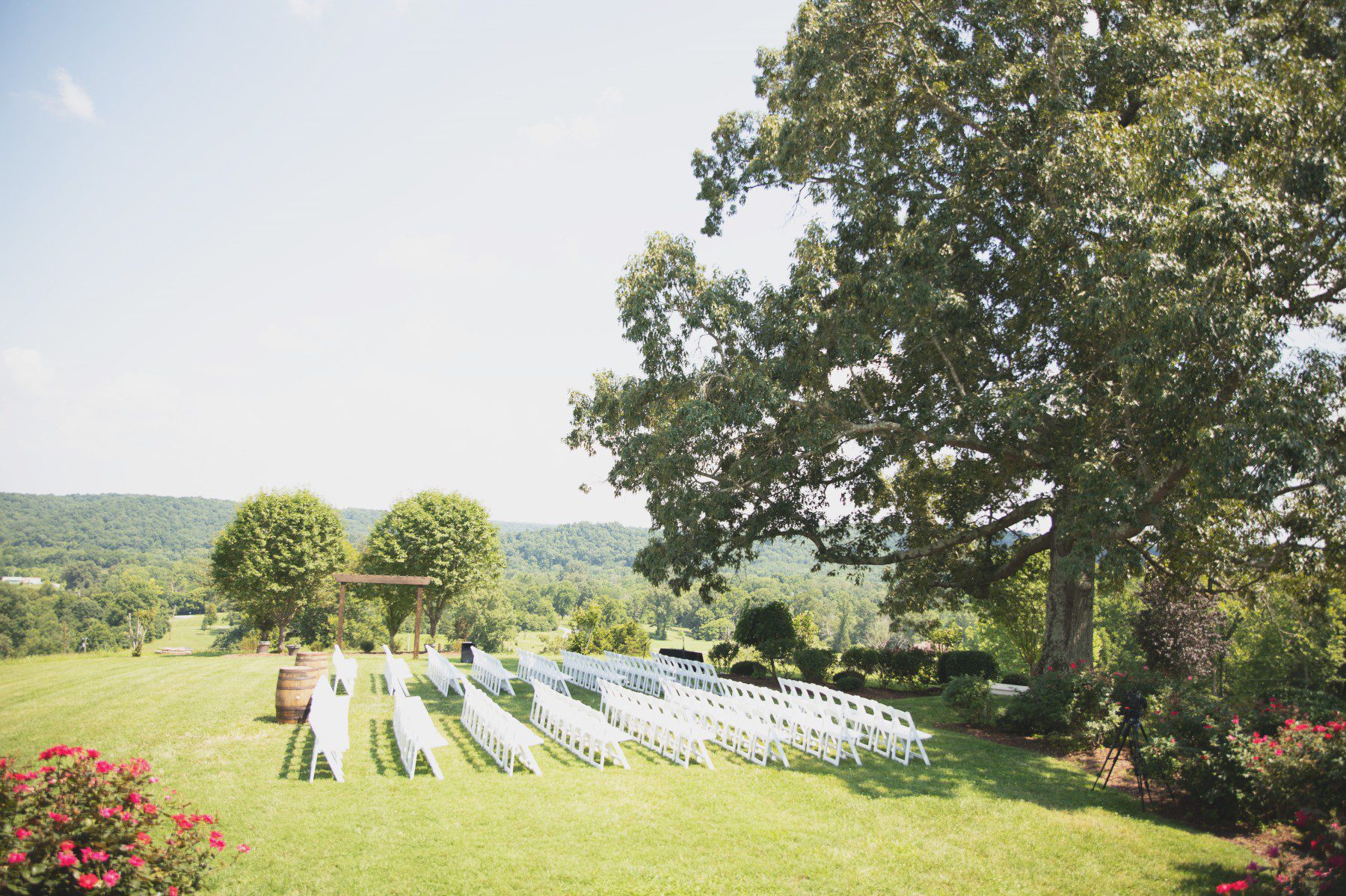 Lovely outdoor ceremony setup at Front Porch Farms with rolling hills in background, Nashville TN