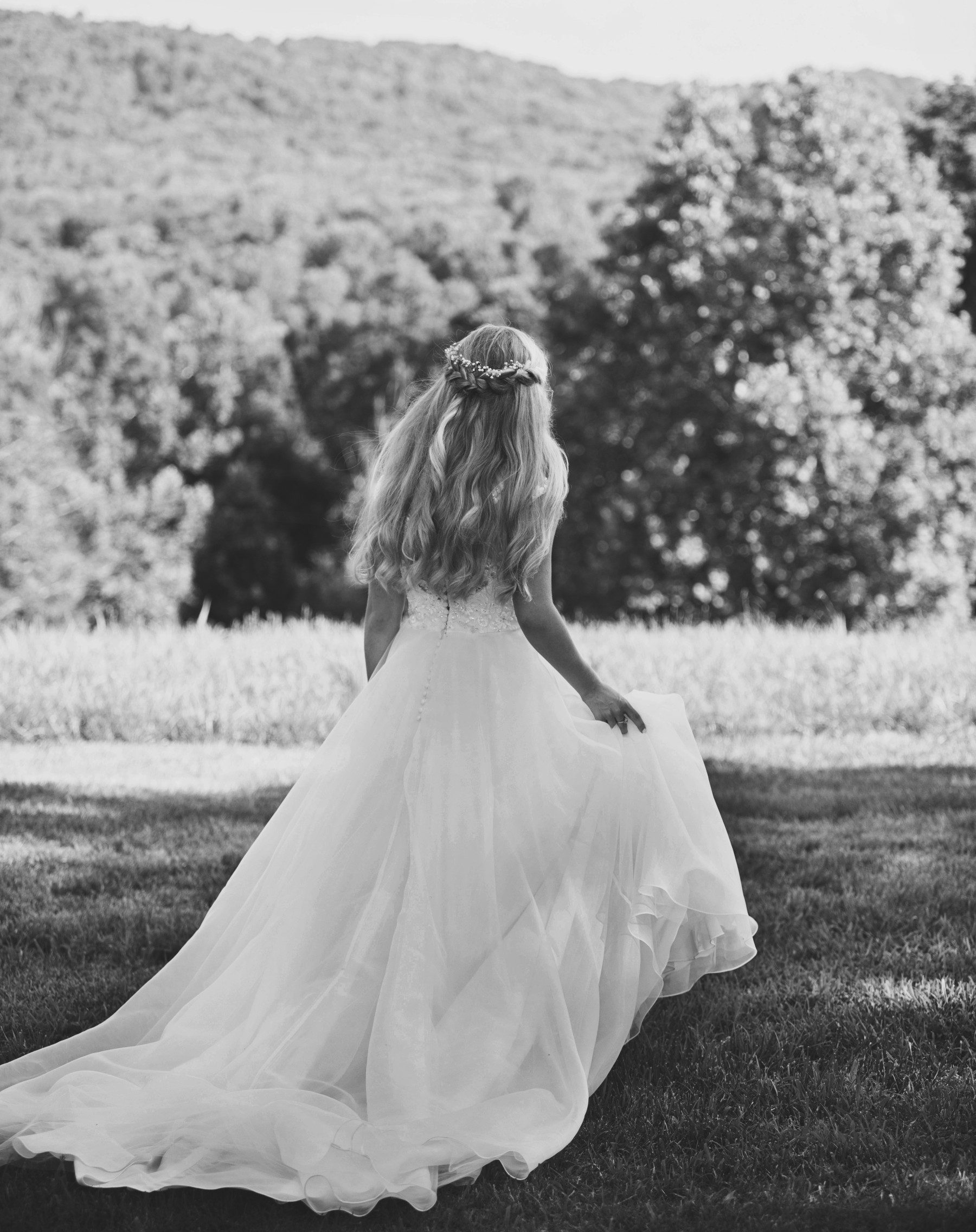 Bride walks back to bridal suite, photo by Krista Lee Photography
