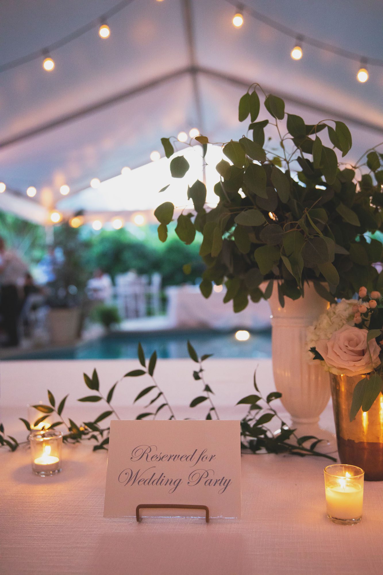 decorations on a table for poolside wedding reception in nashville