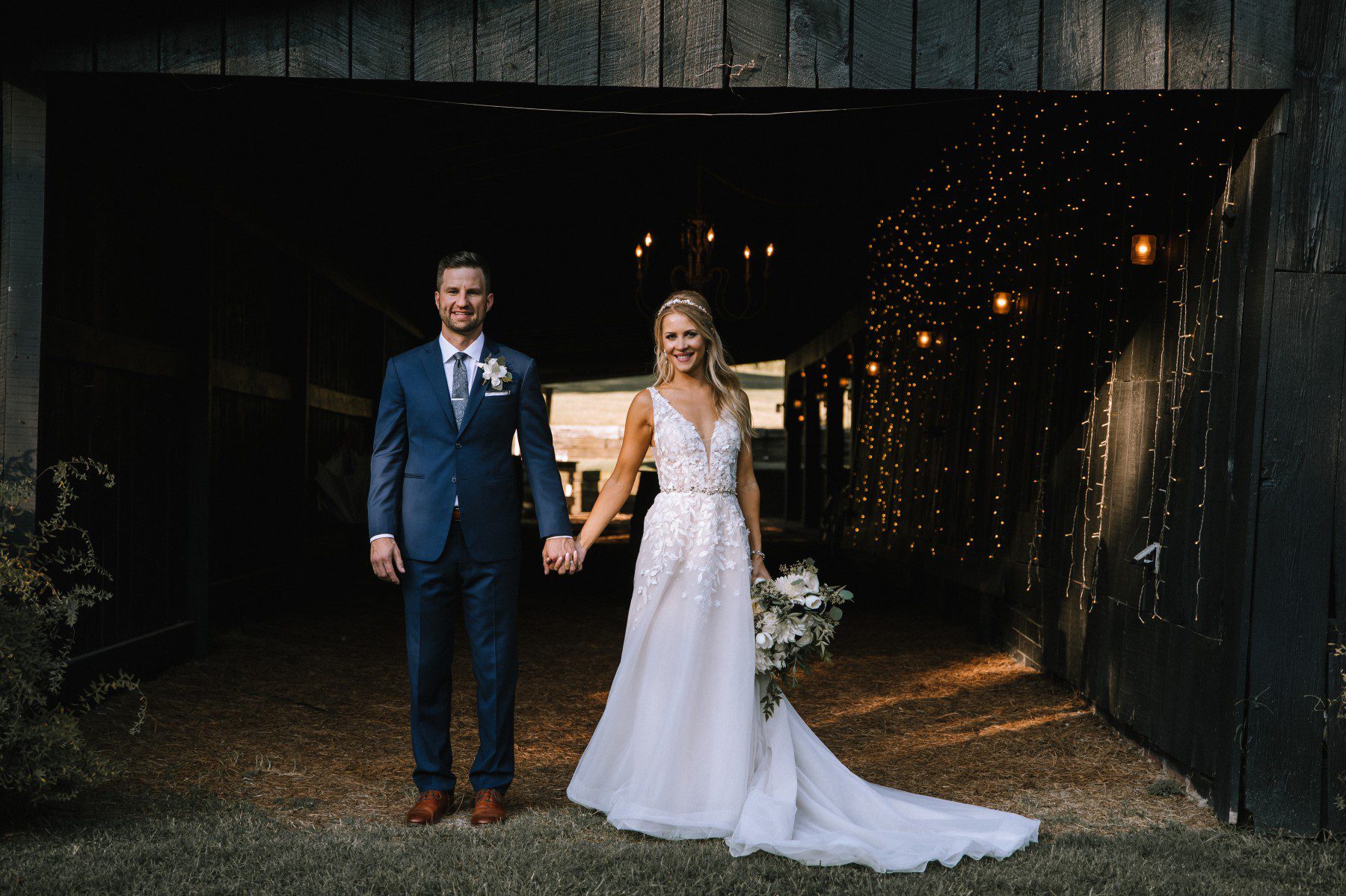 bride and groom pose for photos at Cedarwood barn wedding venue nashville tn