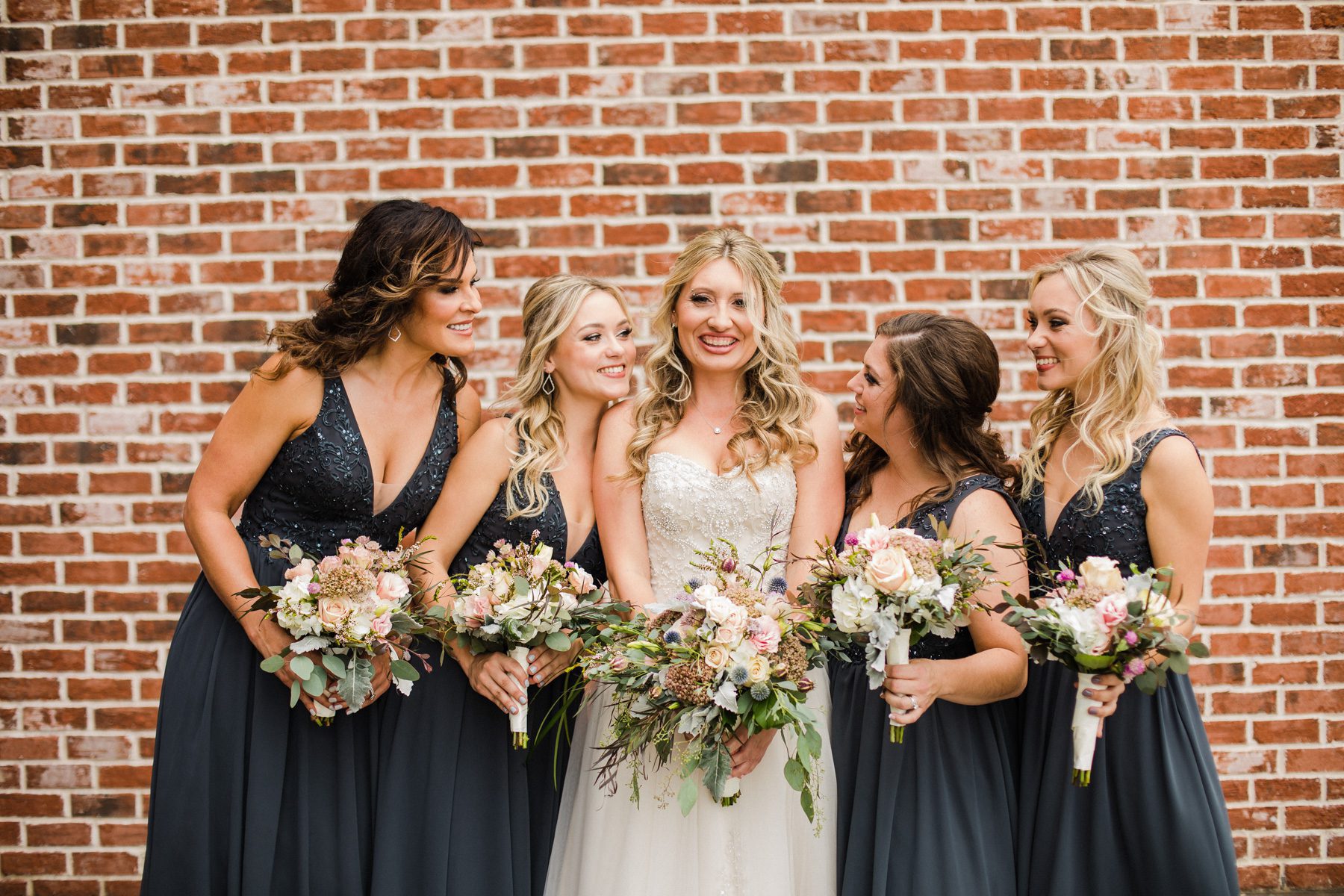 Bride with bridesmaids Clarksville, TN Old Glory Distilling Go.