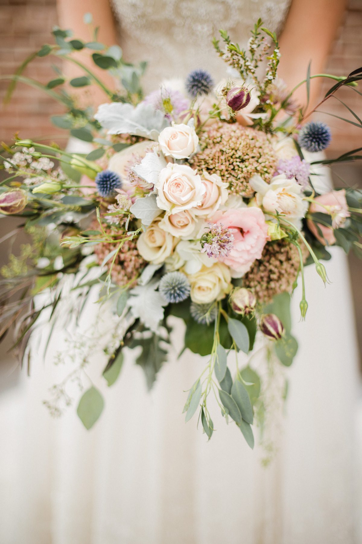 Romantic pastel bridal bouquet with roses, lisianthus