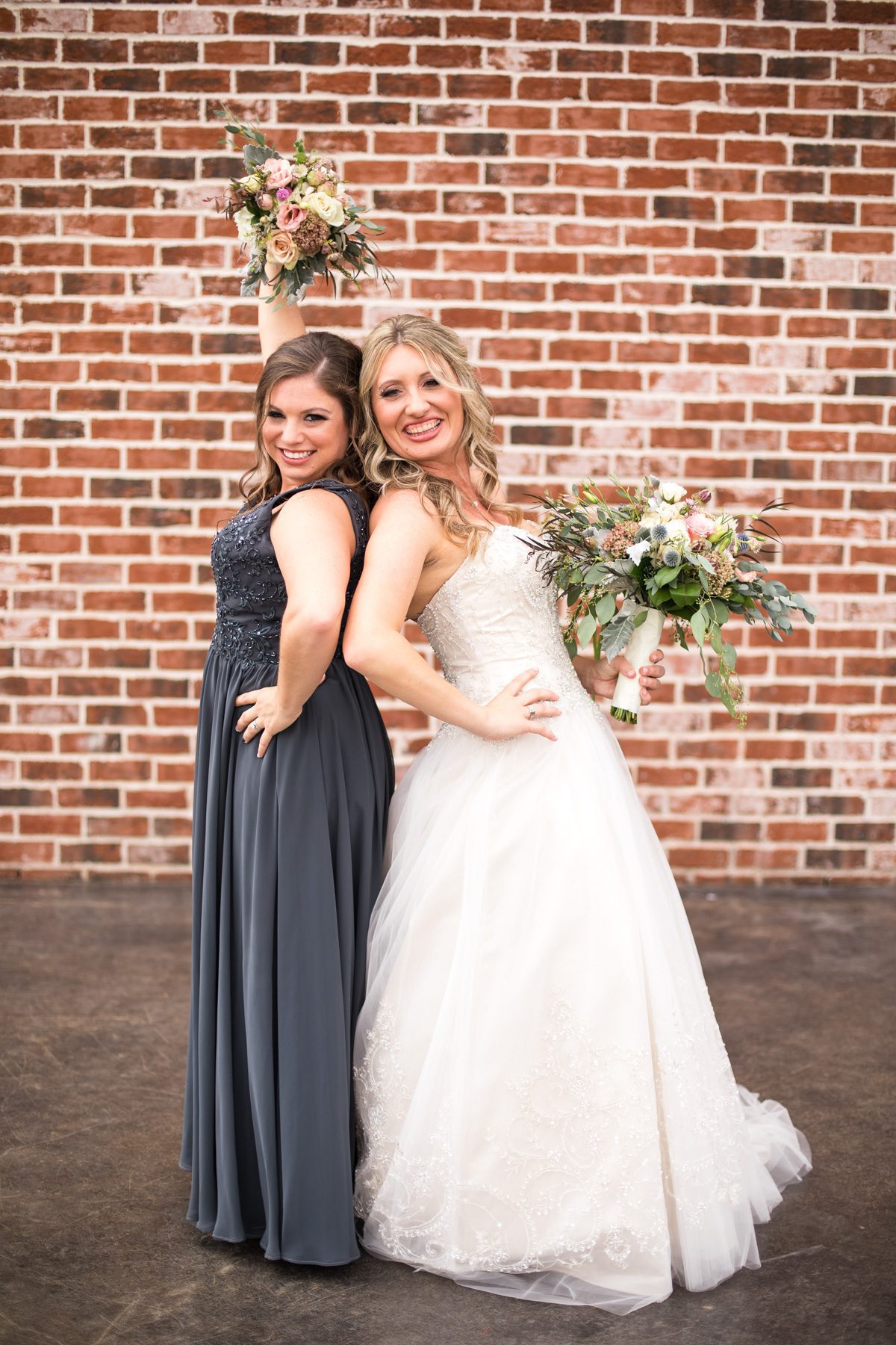 Bride with bridesmaid Clarksville, TN Old Glory Distilling Go.
