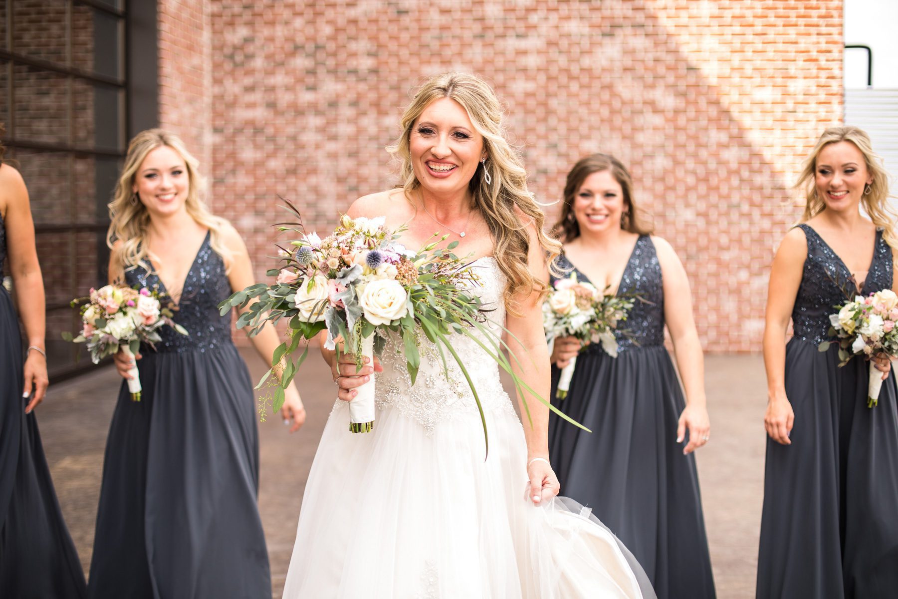 Bride with bridesmaids Clarksville, TN Old Glory Distilling Go.