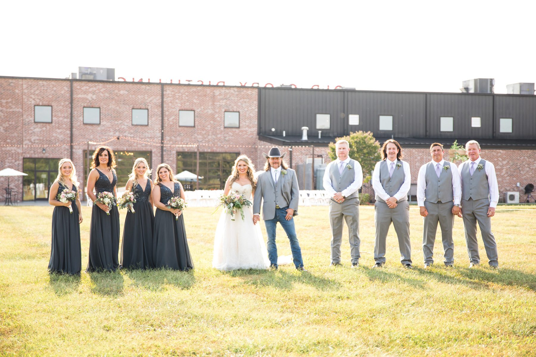 bride and groom with wedding party Old Glory Distilling Co. Clarksville, TN 