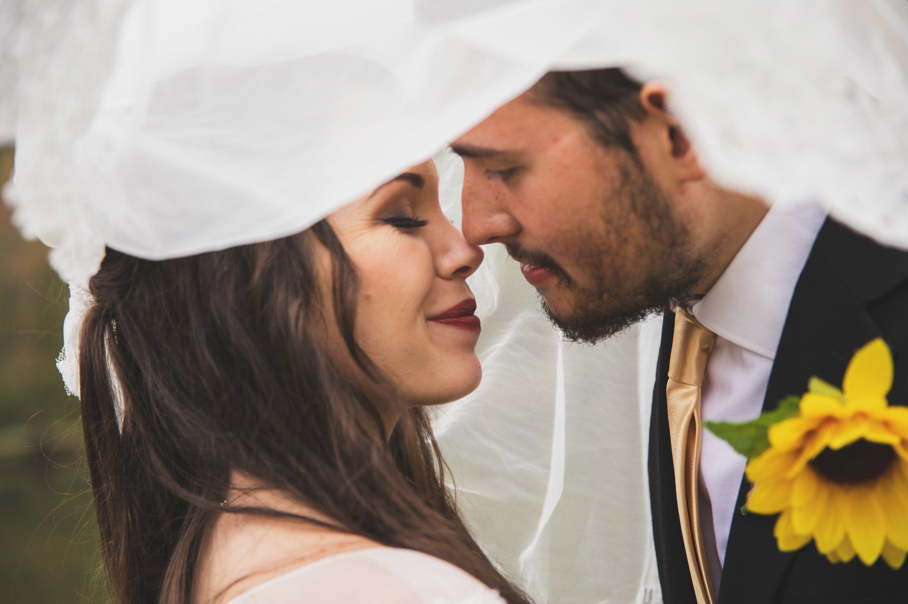 Nashville wedding photographer fall bride and groom under veil 