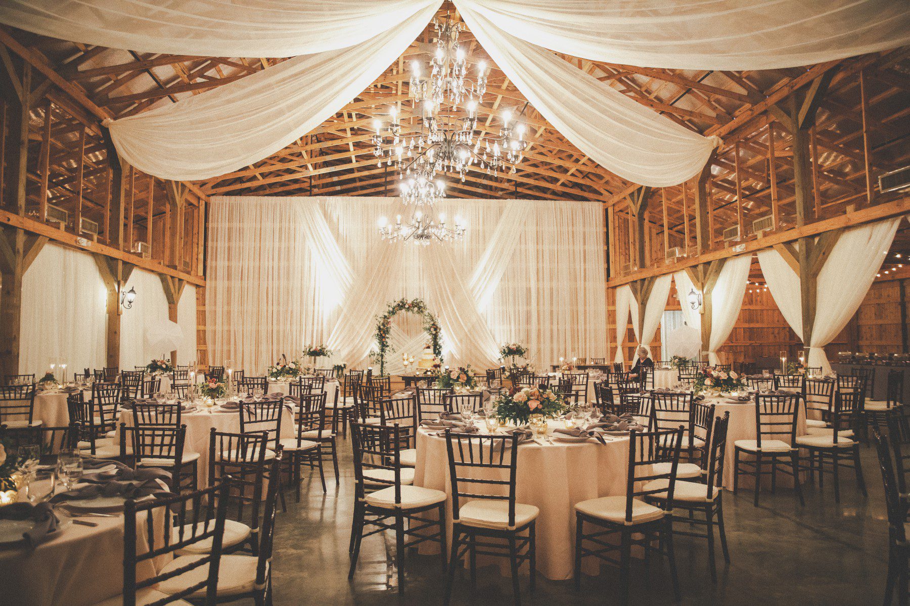 Barn wedding reception venue with chandeliers draping Saddle Woods Farm Murfreesboro, TN 