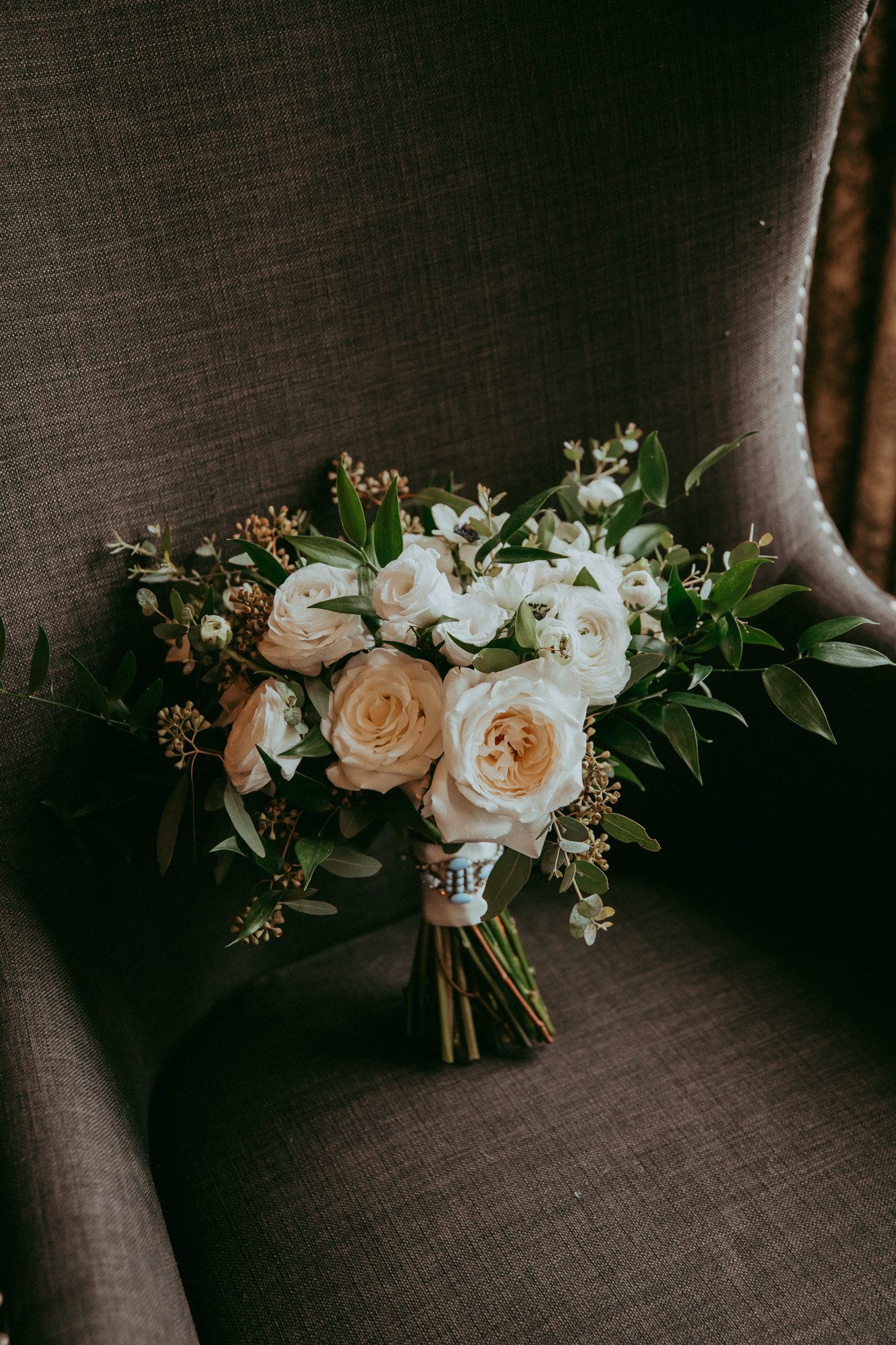 Boho wedding bouquet with roses and ranunculus 
