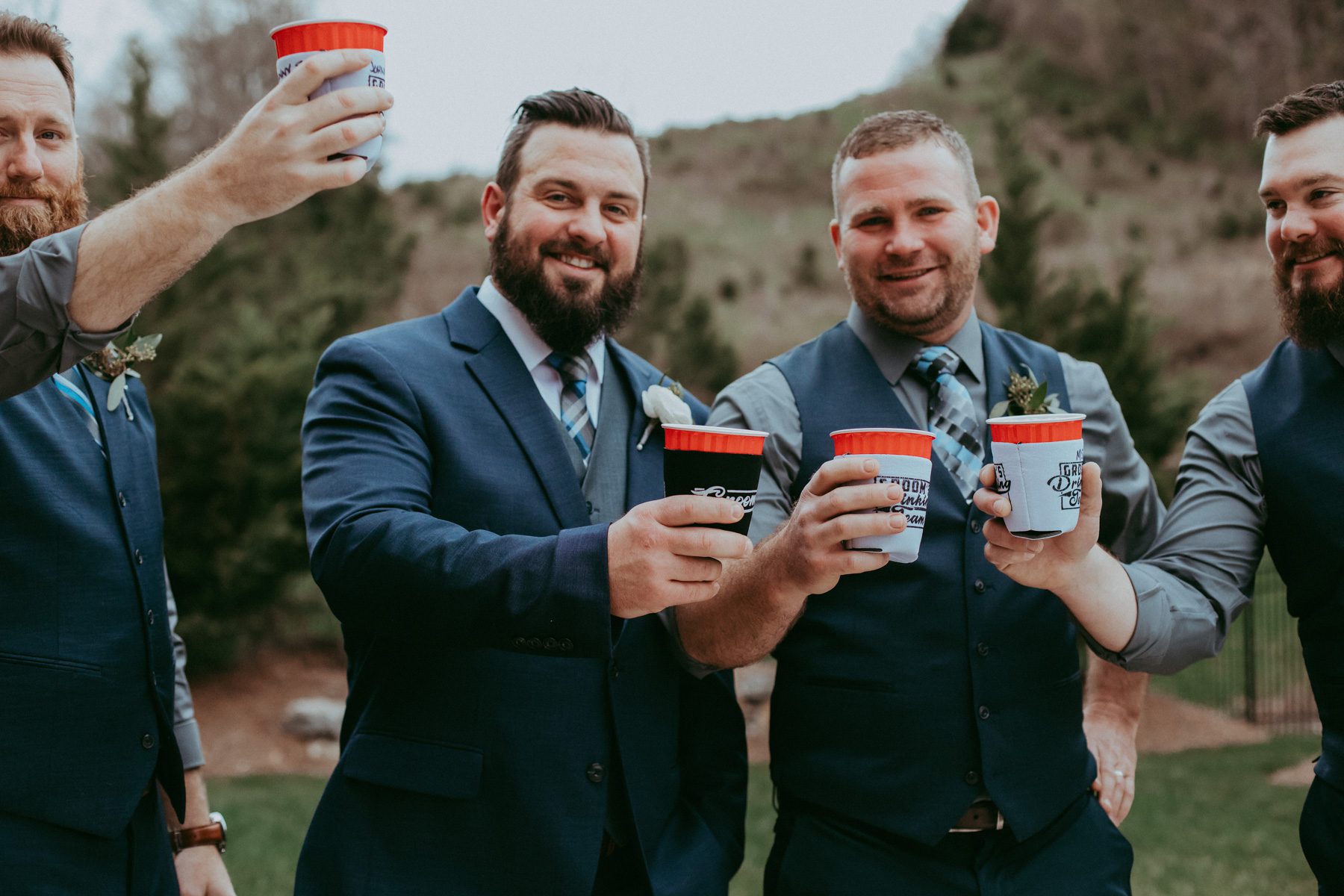 Groom hanging out with groomsmen 