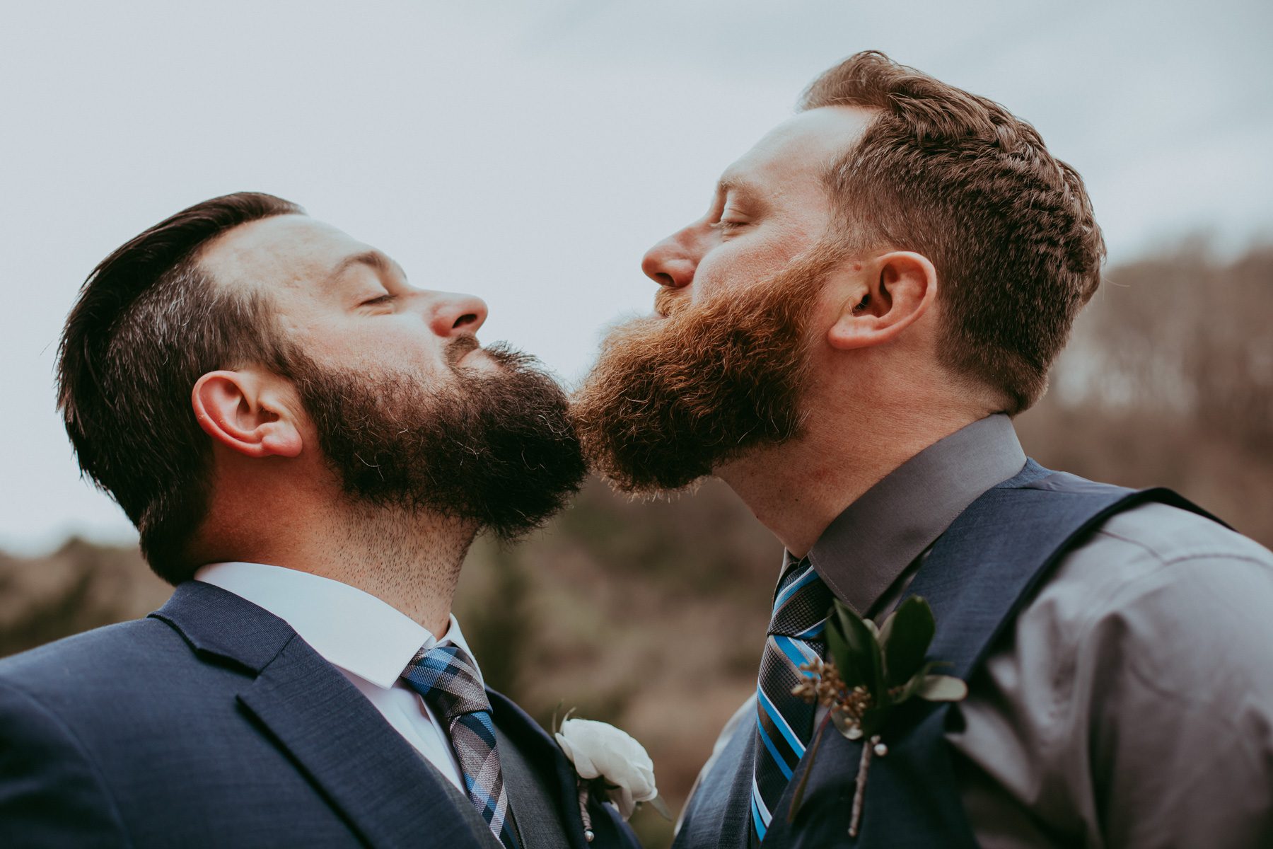 Groom and groomsmen comparing beards