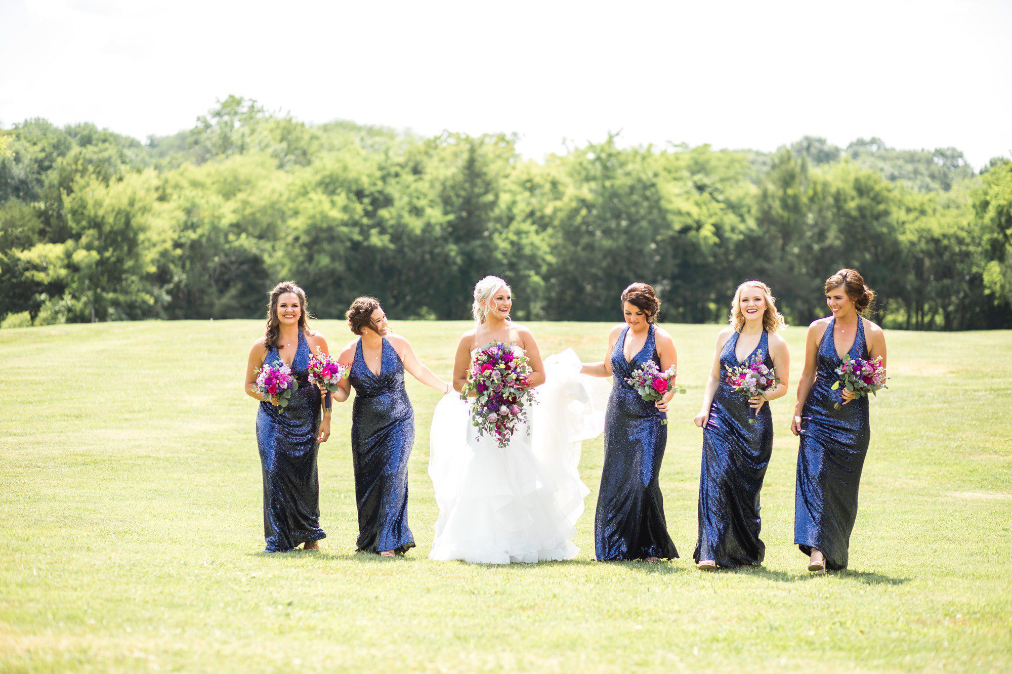 Christina Wu bridesmaids for navy bridal party in field