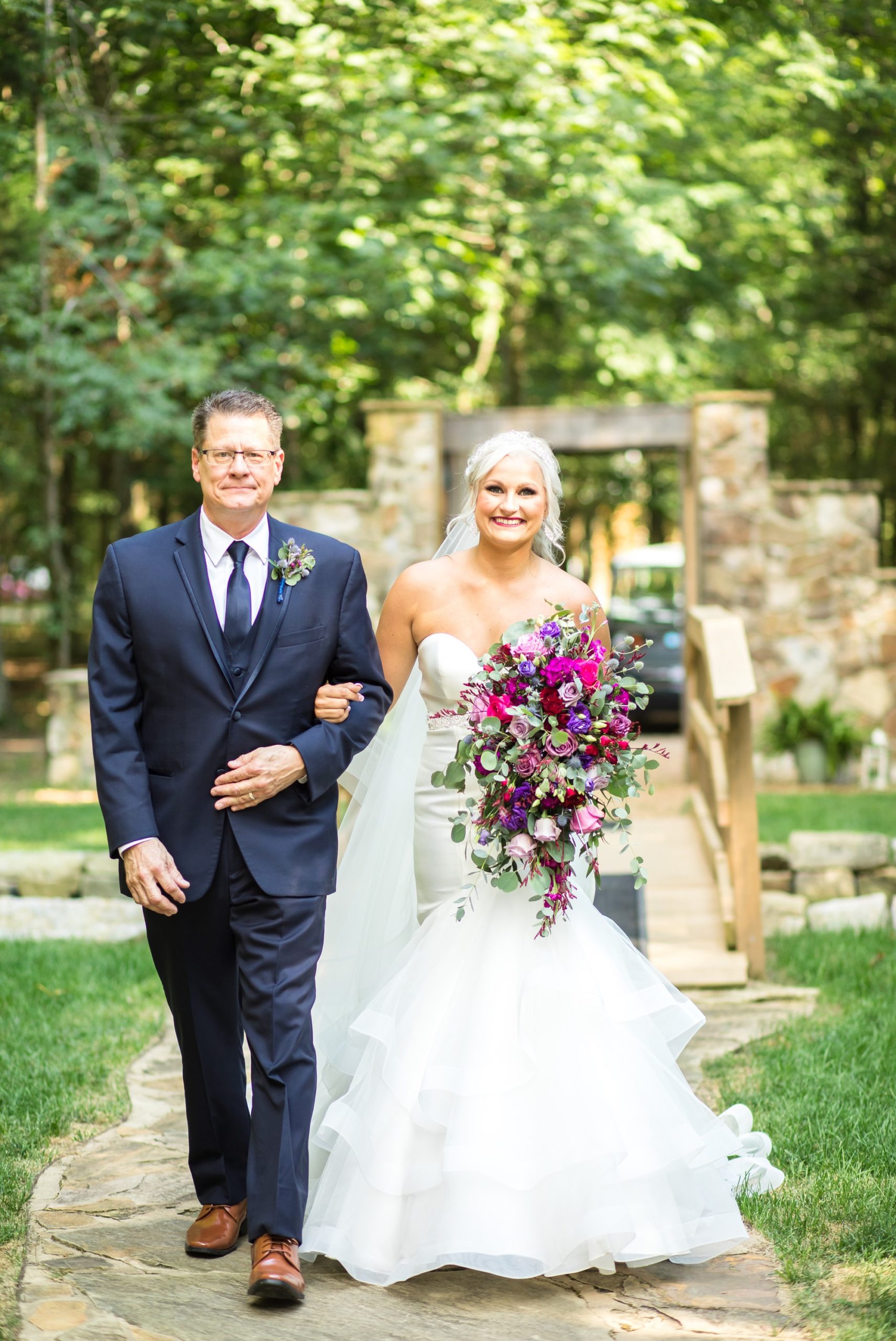 bride and dad walk down aisle at grace valley farm