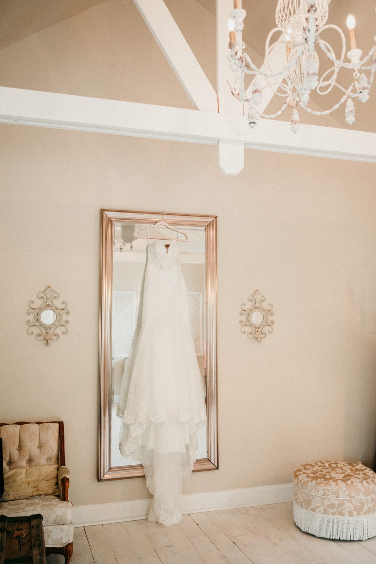 bride's dress hangs in bridal suite before wedding ceremony at Front Porch Farms Charlotte TN