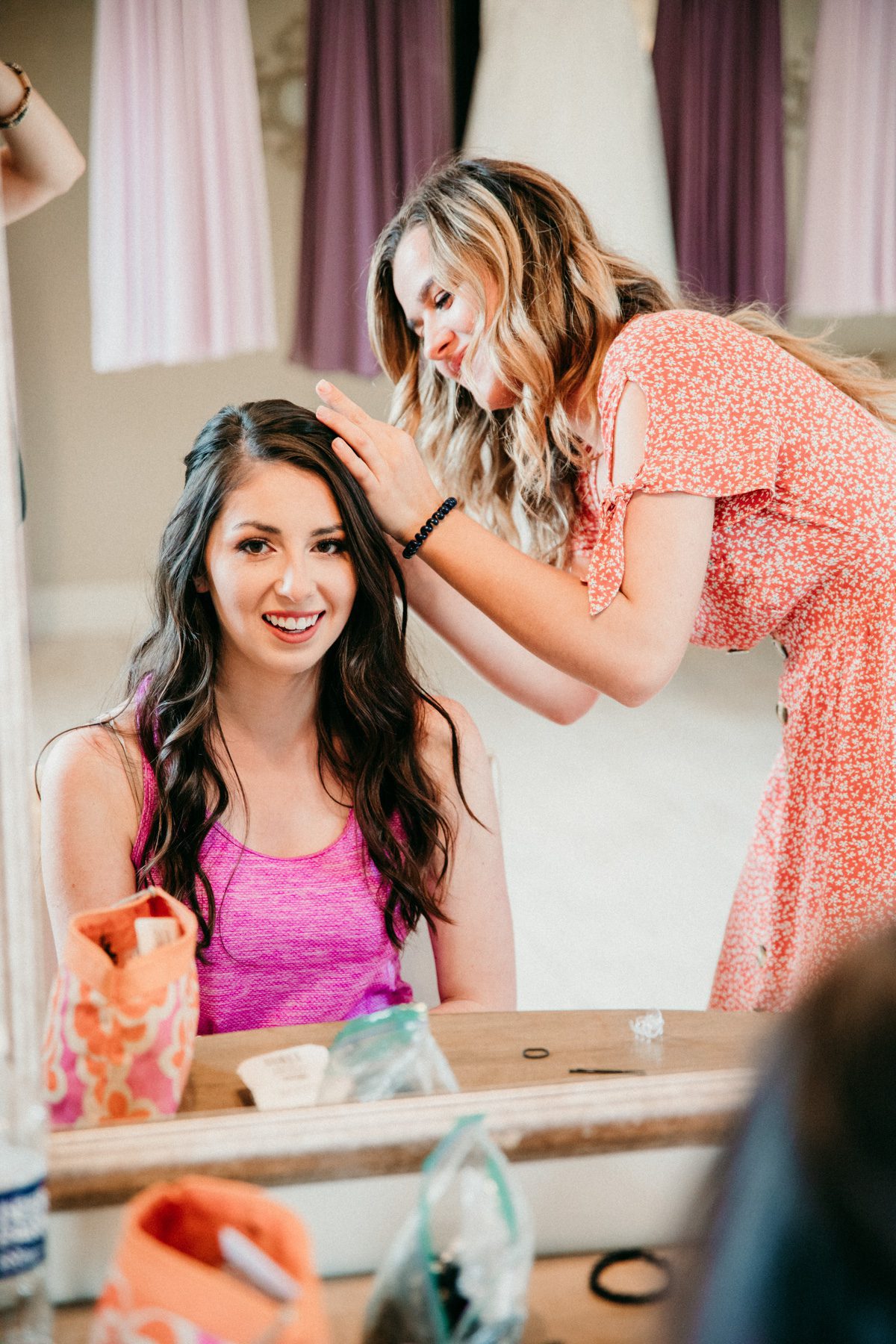 bride gets hair and makeup before ceremony front porch farms
