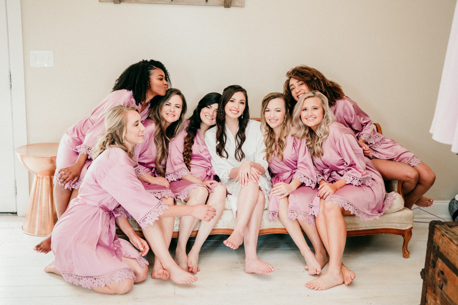 bride and bridesmaids relax in bridal suite front porch farms tennessee