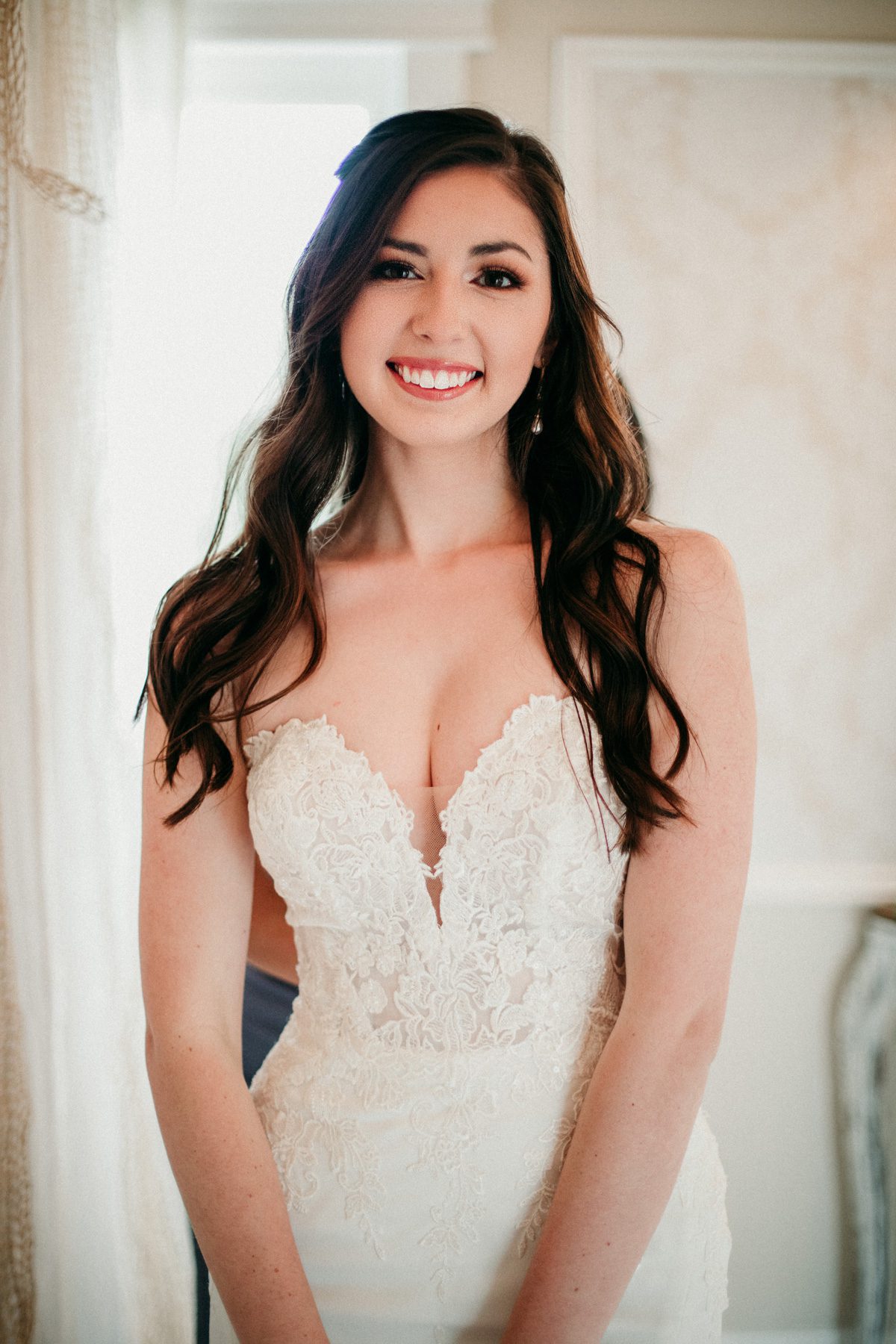 Natural bride in lace strapless sweetheart wedding gown