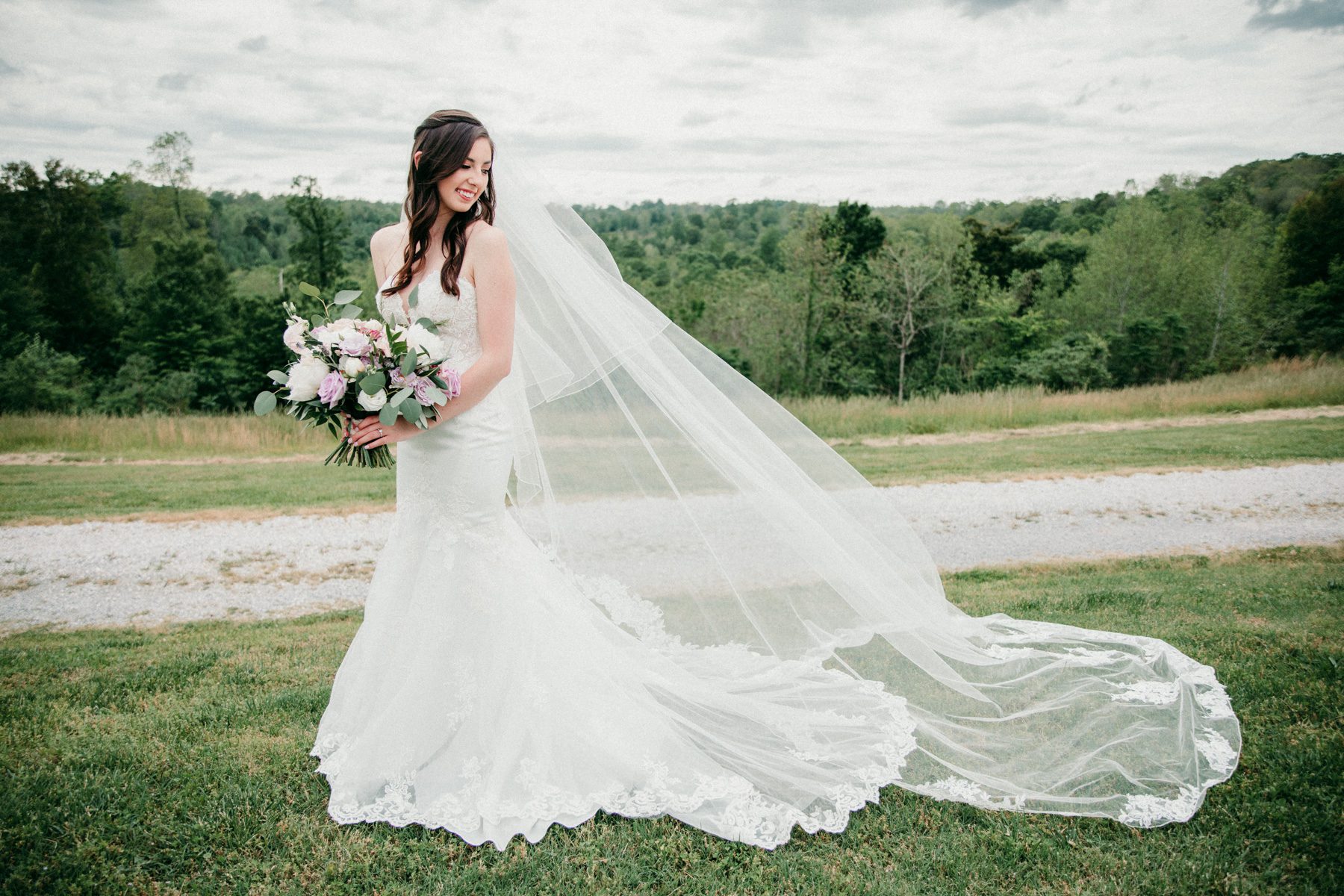 Bride in Stella York gown in Tennessee field 