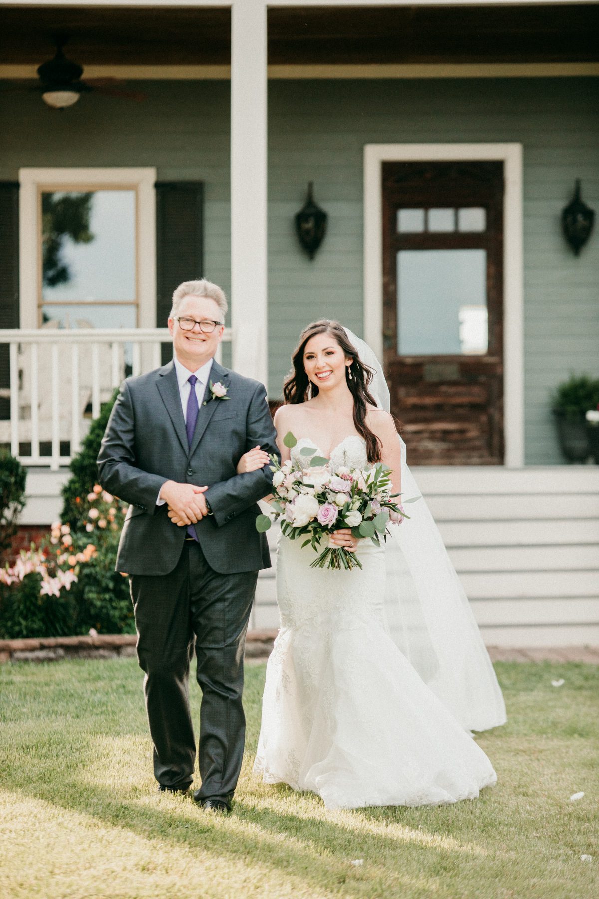 bride walks down the aisle in outdoor ceremony wedding processional 