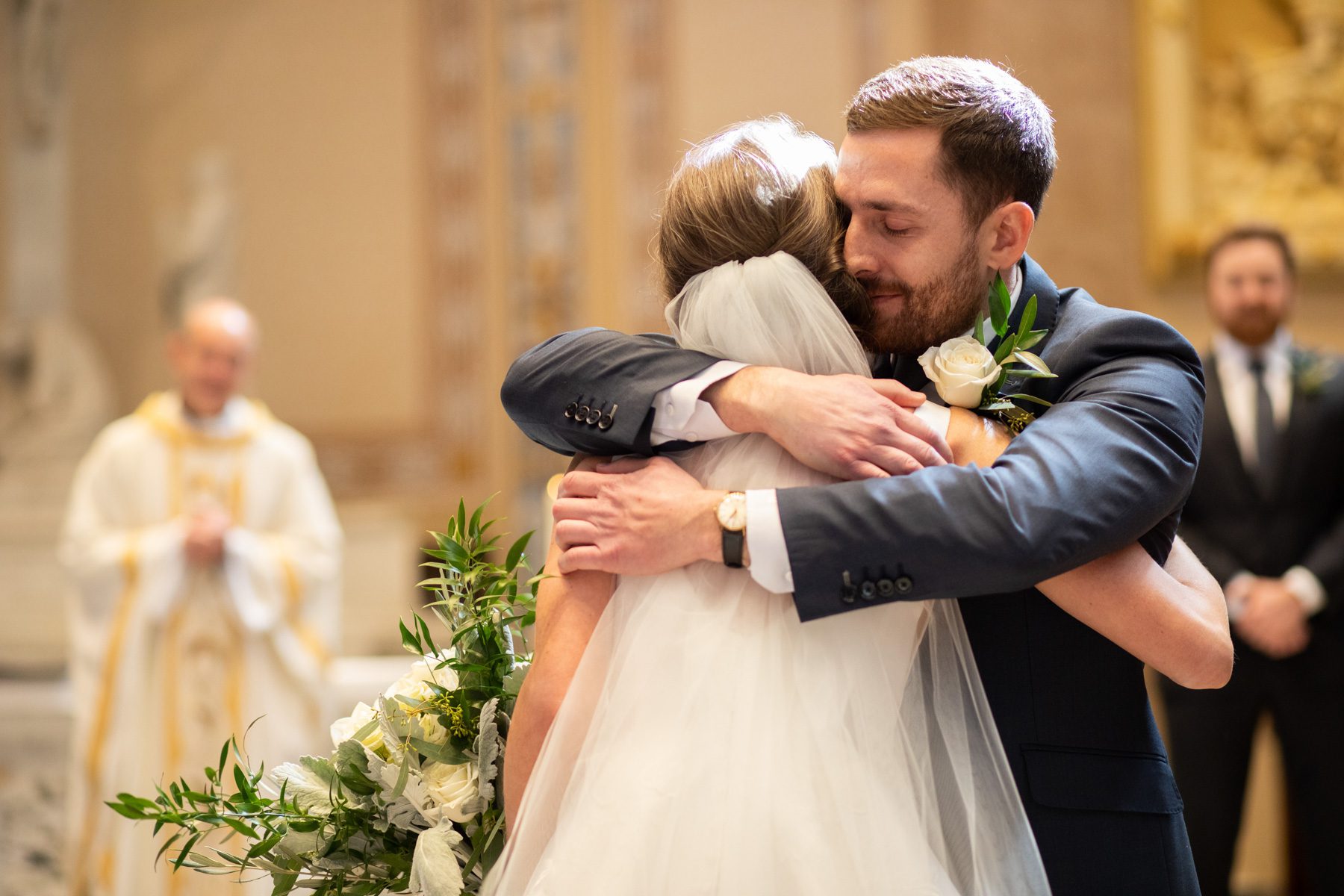 groom hugs bride during ceremony at Cathedral of Incarnation Nashville TN 