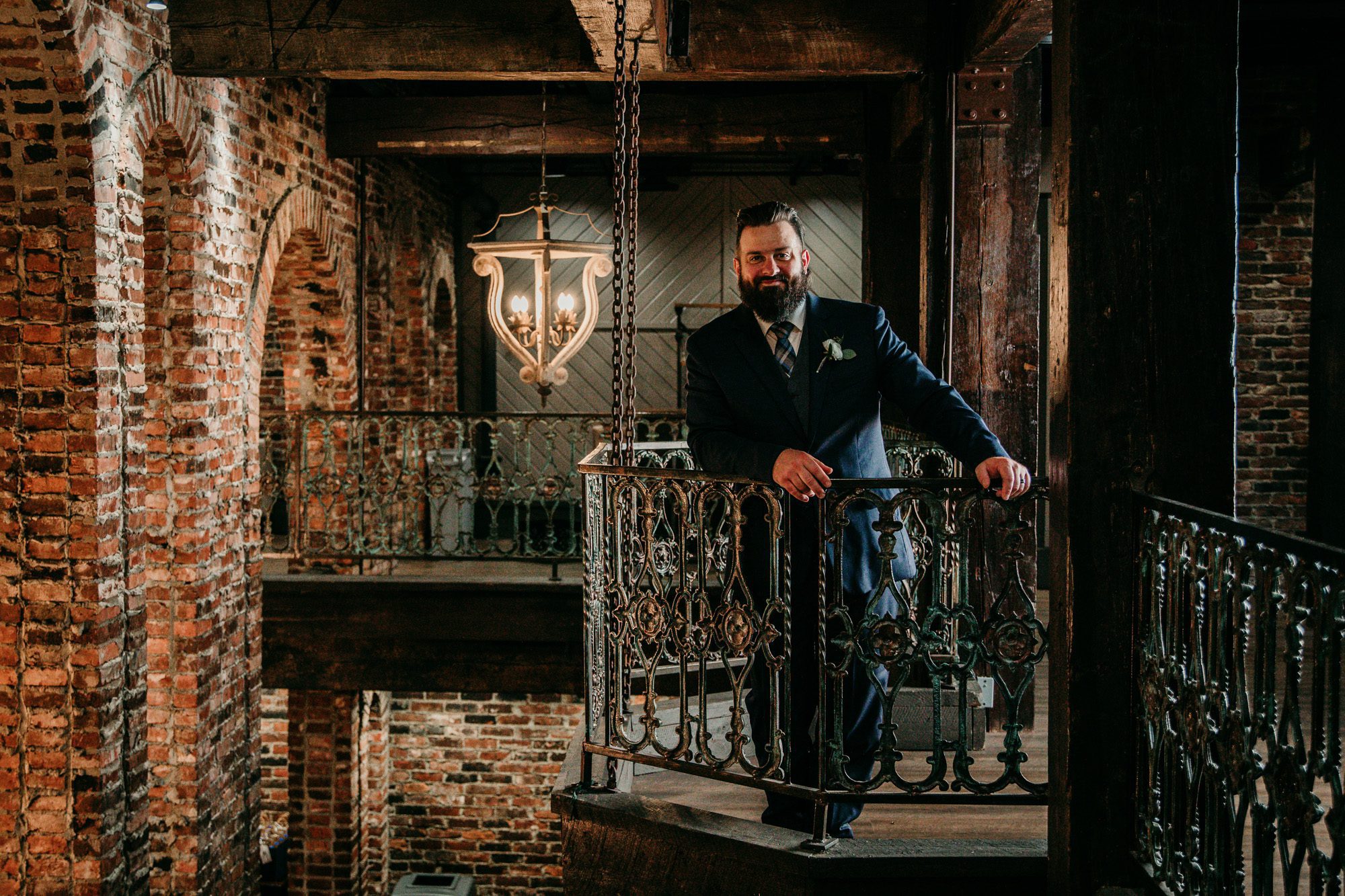 Groom inside a vintage brick building old world charm at the Bedford event and wedding venue in Nashville TN. Photo by Krista Lee Photography