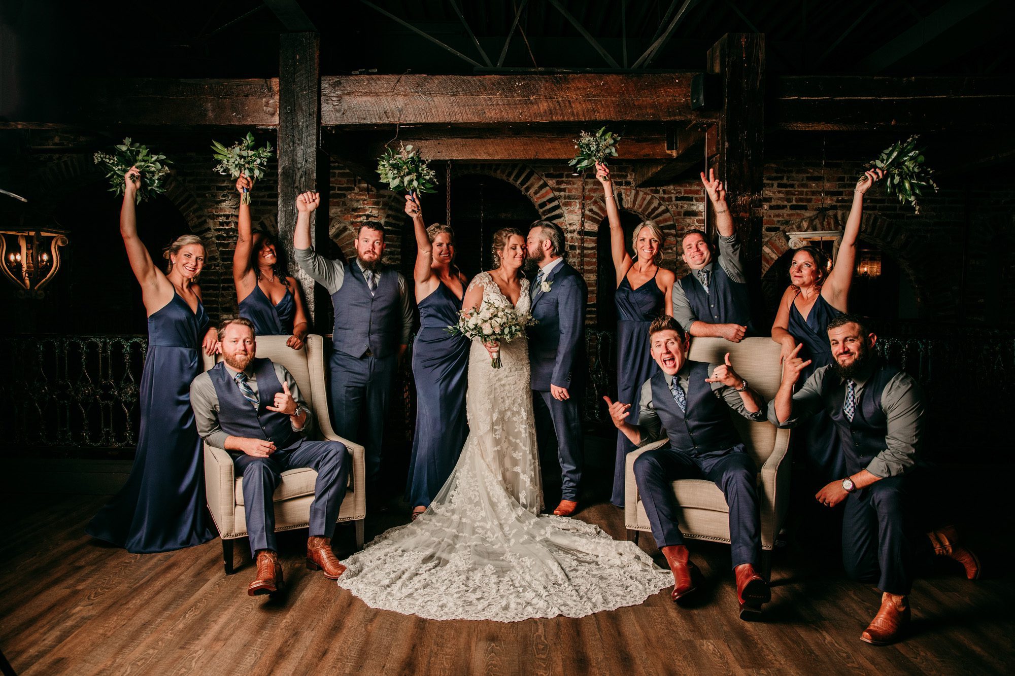 Bridal party groomsmen and bridesmaids upstairs inside a vintage brick building old world charm at the Bedford event and wedding venue in Nashville TN. Photo by Krista Lee Photography